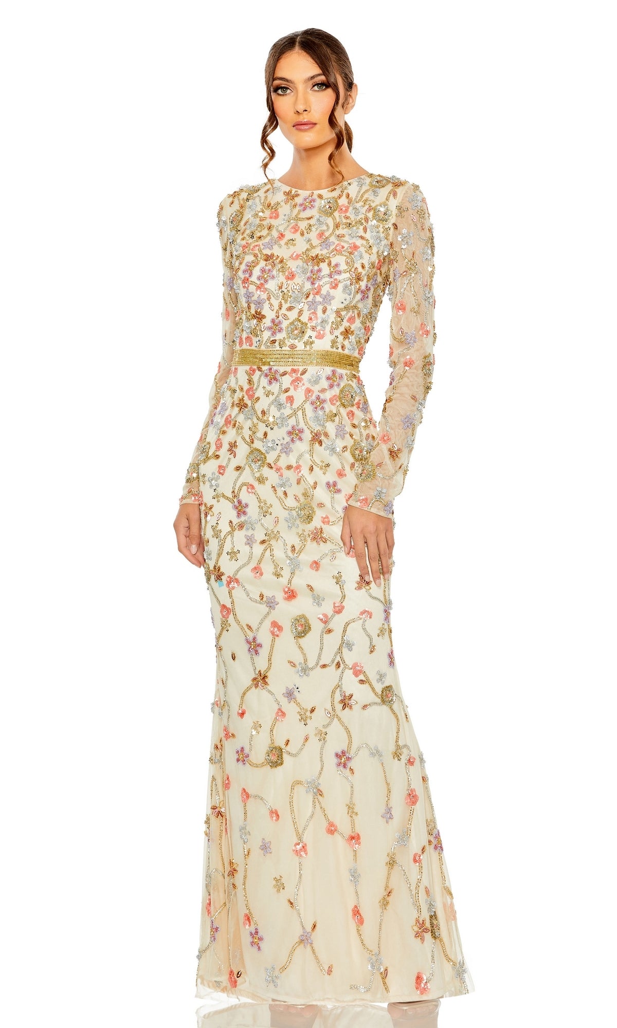 A woman poses elegantly in the Long Formal Dress 6016 by Mac Duggal, featuring nude floral beading, sheer long sleeves, and a gold belt, set against a white background.